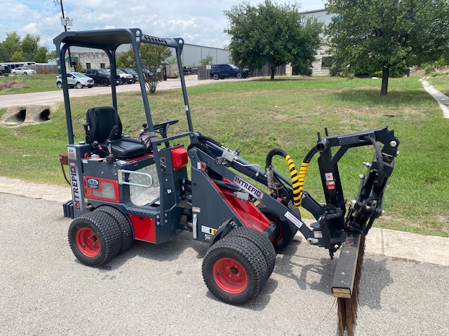 Example of a lightly used small articulated loader (Intrepid KM85) with branch manager grapple and rake